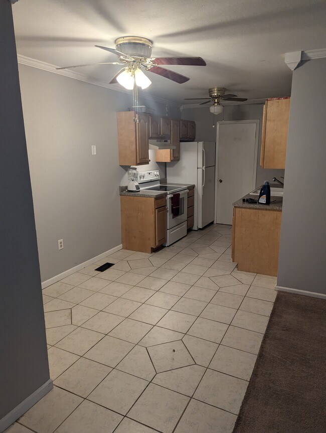 Pantry door next to fridge. Nice size. - 2275 N Cable Rd