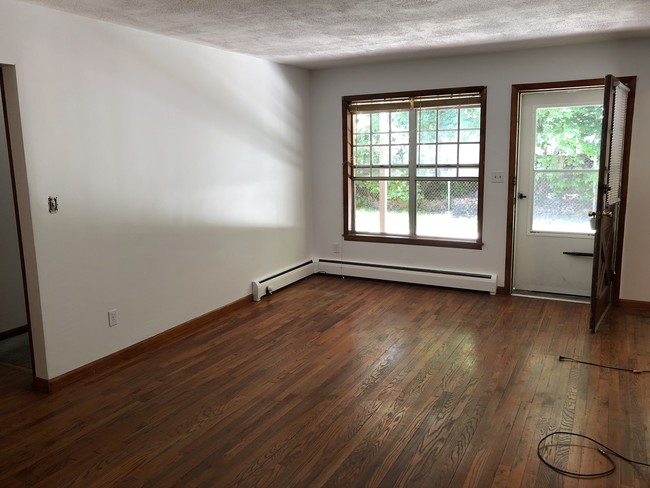 Living room windows/front door - 1 Colonial Rd