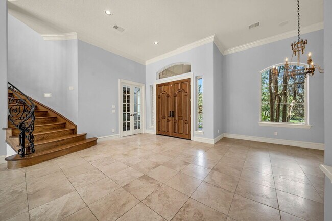 Foto del edificio - Exceptional 5-bedroom home (2 down) in desirable Woodlands Country Club with landscape & pool mai...
