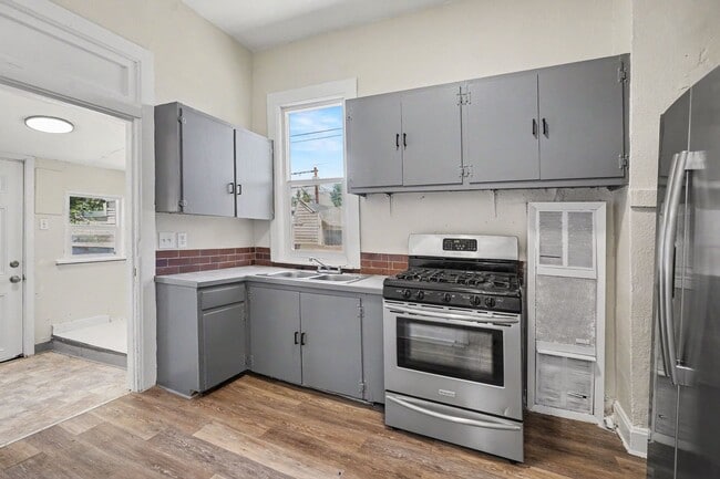 Photo - Charming 2 Bed / 1 Bath Duplex with Private Yard & Off-Street Parking Townhome