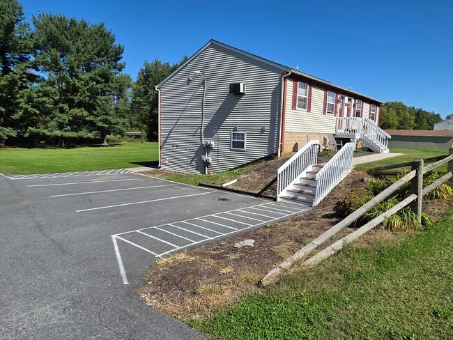 1 designated parking spot per unit with 3 visitor spots and on-street parking as well. - 152 Church St