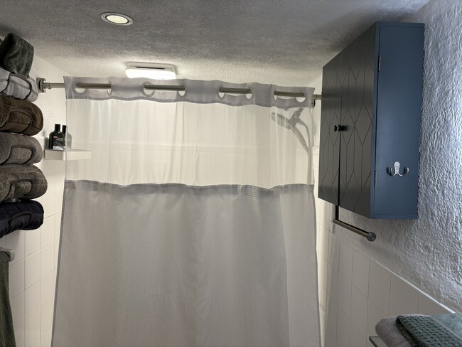 Bathroom with a tub and shower - 1500 Bay Rd