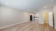 Located at 2500 Tiny Town Rd in Clarksville, TN, this two-story home offers a clean, modern design across three bedrooms and three bathrooms. The main floor features light wood-look LVP flooring throughout, lending a cohesive and contemporary feel. The open kitchen and living area serves as the heart of the home, with white shaker-style cabinetry, dark countertops, and a full suite of stainless steel appliances including a refrigerator with ice maker, electric range, microwave, and dishwasher. Recessed lighting illuminates the space, while a windowed back door brings in natural light. A half bath on the main level adds convenience for guests. Upstairs, the three bedrooms feature neutral-toned carpet and large windows with blinds, filling each room with natural light and offering views of the surrounding neighborhood. The primary bedroom provides a comfortable retreat with dedicated closet space. The bathrooms are finished with white vanities, brushed nickel fixtures, and a tub-shower combination. Throughout the home, neutral warm-gray walls and clean white trim create a bright, move-in-ready atmosphere that is both practical and inviting.
