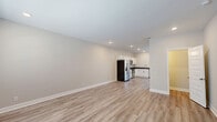 Located at 2500 Tiny Town Rd in Clarksville, TN, this two-story home offers a clean, modern design across three bedrooms and three bathrooms. The main floor features light wood-look LVP flooring throughout, lending a cohesive and contemporary feel. The open kitchen and living area serves as the heart of the home, with white shaker-style cabinetry, dark countertops, and a full suite of stainless steel appliances including a refrigerator with ice maker, electric range, microwave, and dishwasher. Recessed lighting illuminates the space, while a windowed back door brings in natural light. A half bath on the main level adds convenience for guests. Upstairs, the three bedrooms feature neutral-toned carpet and large windows with blinds, filling each room with natural light and offering views of the surrounding neighborhood. The primary bedroom provides a comfortable retreat with dedicated closet space. The bathrooms are finished with white vanities, brushed nickel fixtures, and a tub-shower combination. Throughout the home, neutral warm-gray walls and clean white trim create a bright, move-in-ready atmosphere that is both practical and inviting.