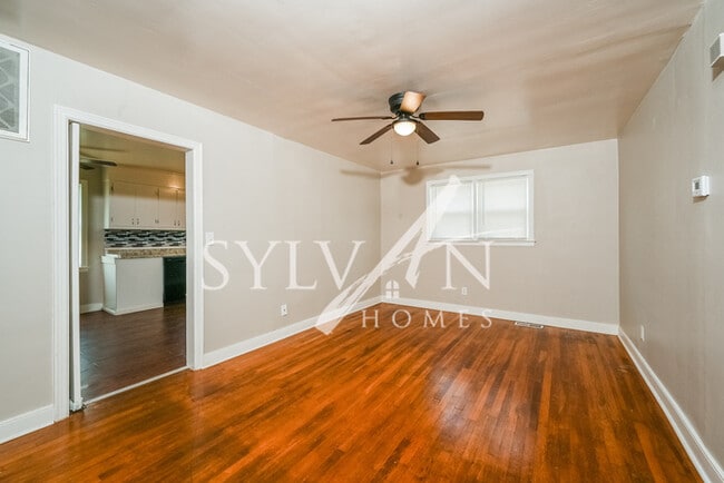 Building Photo - The living is easy in this 4 bedroom, 1.5 ...
