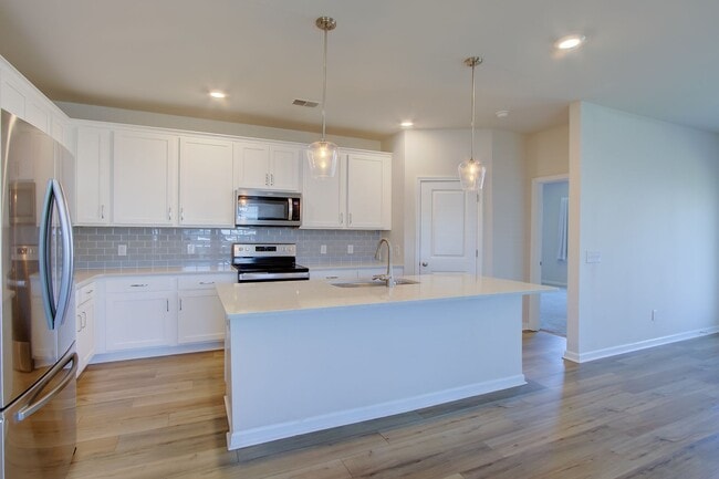 Building Photo - Spacious 4BR Rental with Stunning Kitchen & Covered Patio