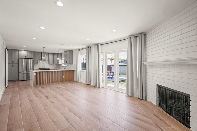 Building Photo - Stylishly Remodeled 4-Bedroom Home in Prim...