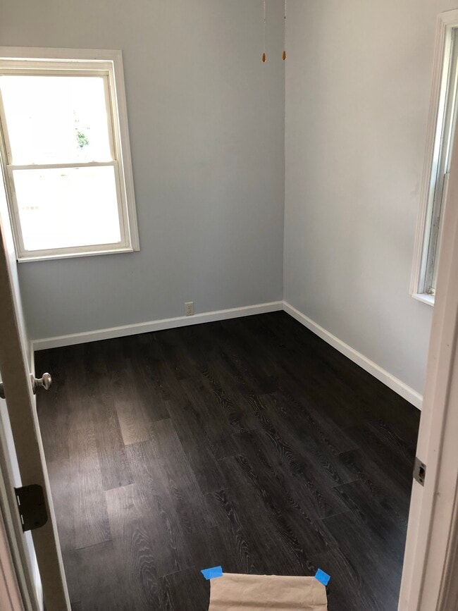 Brand new hardwood floor in the bedroom with a walk in closet - 717 Liberty St