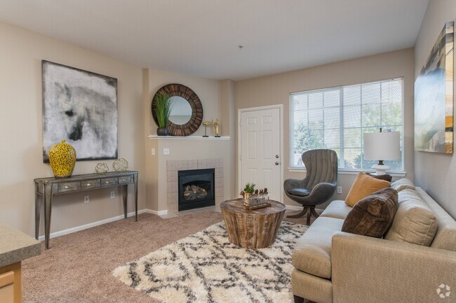 Living Room with Private Patio Access - PeakView at T-Bone Ranch Apartments