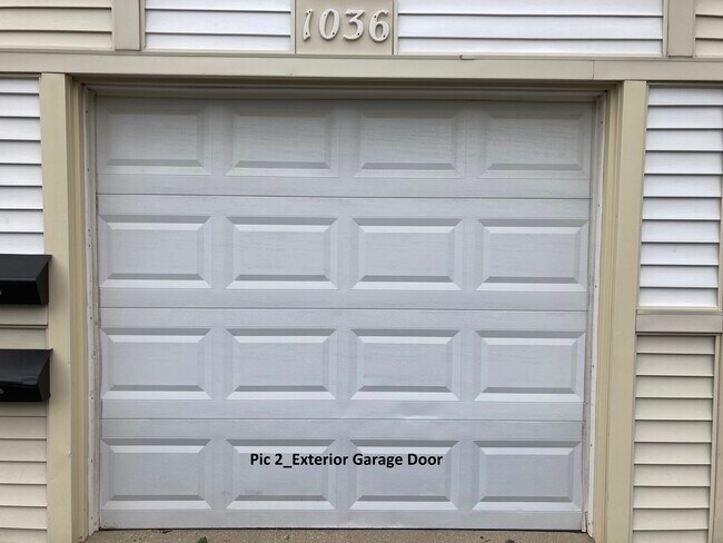 Pic 2_Exterior Garage Door - 1036 Inverrary Ln