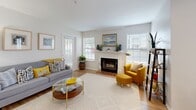 Located at 100 Christina Mill Dr in Newark, Delaware, this thoughtfully designed one-bedroom, one-bathroom residence offers a functional and stylish open-concept layout across a single floor. The kitchen is a standout feature, showcasing granite countertops, warm wood cabinetry, stainless steel appliances, and a peninsula island with bar seating — ideal for casual dining or entertaining. It flows seamlessly into the dining area, which is brightened by a large window, and into the living room beyond. The living room is warm and inviting, anchored by a classic wood-burning fireplace framed by large windows that fill the space with natural light. Hardwood-style flooring runs throughout the main living areas, adding continuity and warmth. The bedroom offers a comfortable retreat with plush carpeting, a ceiling fan, and a window overlooking the outdoors. The bathroom features granite countertops, modern cabinetry, and hardwood-style flooring, maintaining the consistent upscale finish found throughout the home. Two closets and an in-unit laundry area provide practical storage and convenience. The overall ambiance is clean, bright, and modern, making this residence a refined and comfortable place to call home.