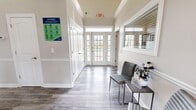 This 620 square foot office space in Canal Winchester, OH, offers a well-designed layout for professional use. The single-story structure comprises five distinct areas, each tailored for specific business functions. The entrance opens into a welcoming reception area with vaulted ceilings, creating an airy atmosphere. Modern vinyl plank flooring extends throughout, providing durability and a contemporary look.

The workspace features a dedicated office with a large desk, ergonomic chairs, and ample natural light from a window. Wall-mounted artwork adds a touch of sophistication. A functional kitchen area boasts white cabinetry, full-sized appliances, and counter space, ideal for employee use or small gatherings.

The bathroom is equipped with modern fixtures, including a wall-mounted sink and necessary amenities. Large windows with blinds allow for privacy control while admitting natural light. The space also includes storage areas and appears to have additional rooms for conferences or private meetings.

Attention to detail is evident in the crisp white walls, recessed lighting, and strategically placed exit signs, ensuring both aesthetics and safety. This compact yet efficiently designed office space is well-suited for small businesses or professional services seeking a polished, functional environment.