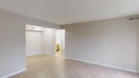 This 600 square foot apartment in Indianapolis offers a practical and contemporary living space. The single-story layout includes two bedrooms, with the primary bedroom boasting a generous 150 square feet. The open-concept design maximizes the available space, creating a seamless flow between the living room and kitchen areas.

The interior is characterized by neutral tones and modern finishes, with light-colored walls and laminate wood flooring throughout. Large windows in the bedrooms and living area allow for ample natural light, enhancing the sense of spaciousness. The kitchen features wooden cabinetry, contrasting black appliances, and white countertops, providing a clean and functional cooking space.

The bathroom is efficiently designed with a combination tub-shower, single vanity, and modern fixtures. A separate laundry room adds convenience to daily living. Storage solutions are integrated throughout, including closet spaces with wire shelving.

The apartment's modest size is well-utilized, making it an ideal choice for individuals or small families seeking a low-maintenance, contemporary living space in a suburban setting. The neutral palette and modern amenities create a blank canvas for personalization, allowing residents to easily make this space their own.