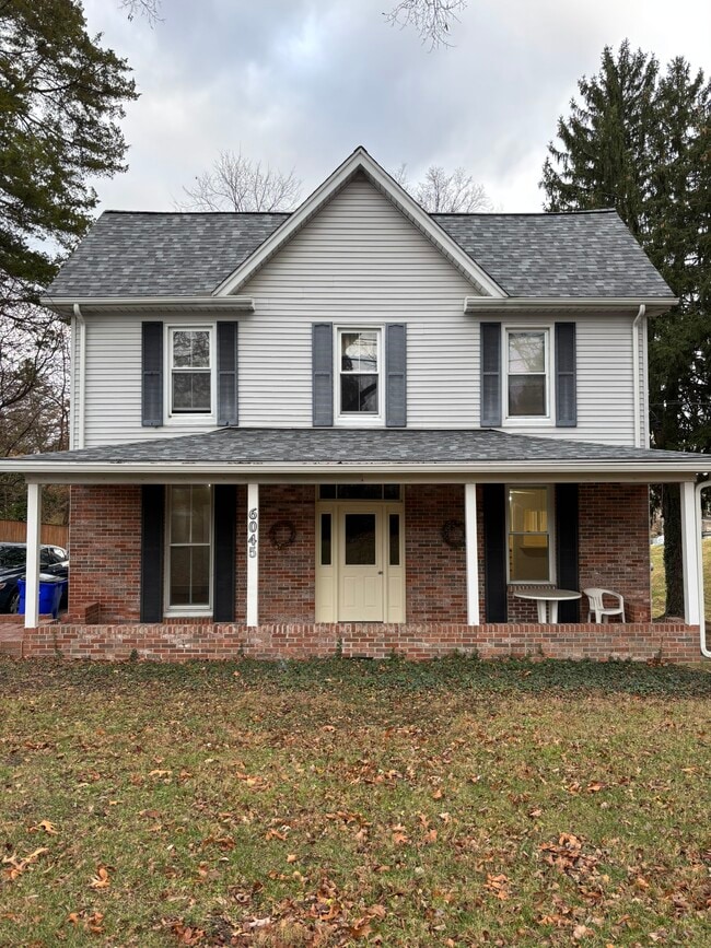 Front view. Apartment 1 is in the first floor to the left - 6045 Old Washington Rd House