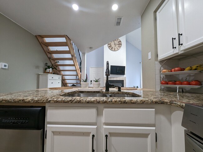 Boosted by granite countertops, this kitchen is a delight for entertaining guests. - 842 S Vance St