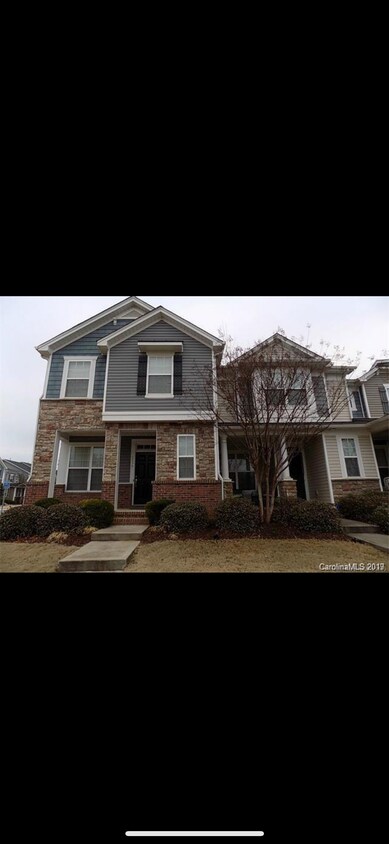 Front of townhome. - 233 E Waterlynn Rd