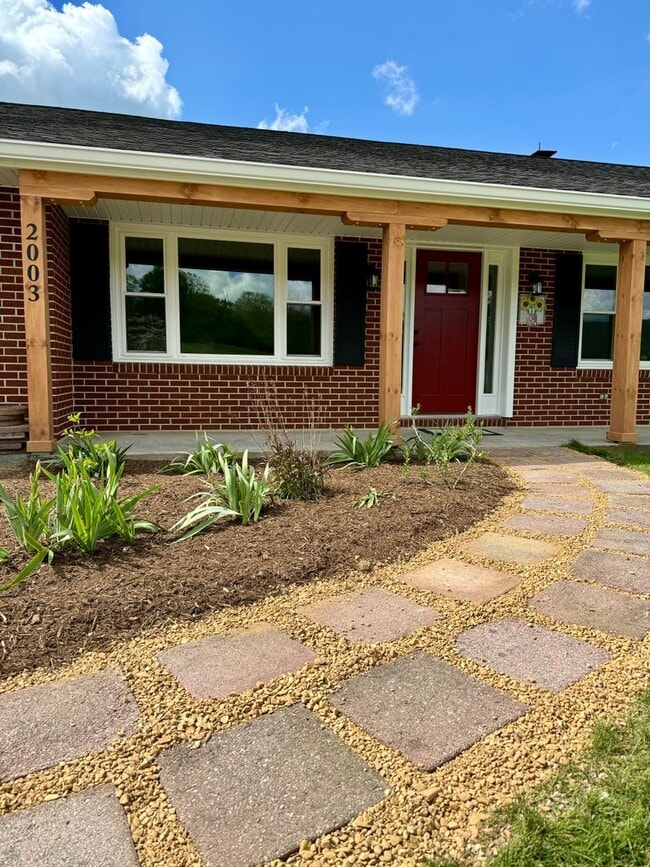 Building Photo - Exquisite Brick Ranch with Modern Upgrades, Countryside Charm And Two Car Garage