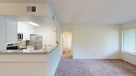 This 800 square foot single-story home in Chester, Virginia offers a well-designed living space with two bedrooms and one bathroom. The property features a modern kitchen with white cabinetry, granite countertops, and stainless steel appliances. The open-concept living and dining area provides a spacious feel, enhanced by carpeted floors and ample natural light from multiple windows.

The primary bedroom, measuring 160 square feet, offers a generous space with a large window and closet. The second bedroom is similarly appointed, providing versatility for a guest room or home office. The bathroom showcases a clean, contemporary design with a white vanity, large mirror, and modern lighting fixtures.

Throughout the home, neutral wall colors and carpeting create a blank canvas for personal decorating styles. The property also includes outdoor space, visible through sliding glass doors, offering potential for relaxation or entertaining. With its efficient layout and updated features, this home presents a comfortable living environment in a suburban setting.