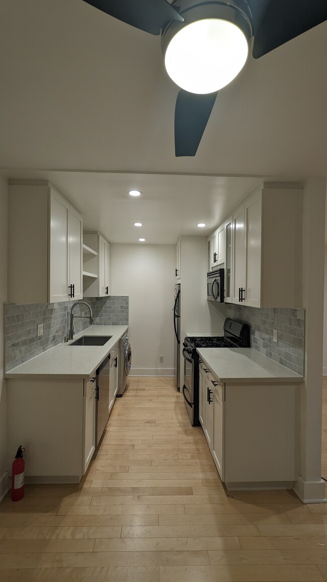 Updated Kitchen, modern appliances, stainless steel sink. New backsplash/countertops and cabinets. - 3131 S Canfield Ave