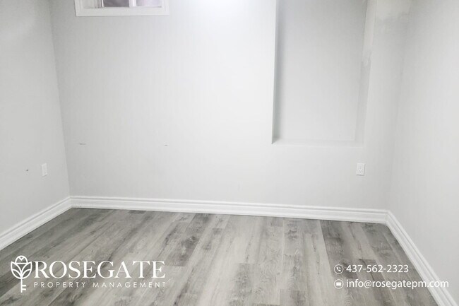 Photo du bâtiment - Bright 2-Bedroom Basement Apartment in Aja...