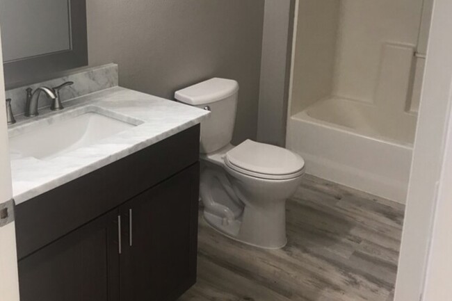 Marble vanity in bathroom - Riverfront Court