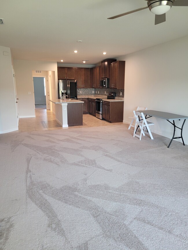 Living room and dining room - 18214 TURNING LEAF Cir