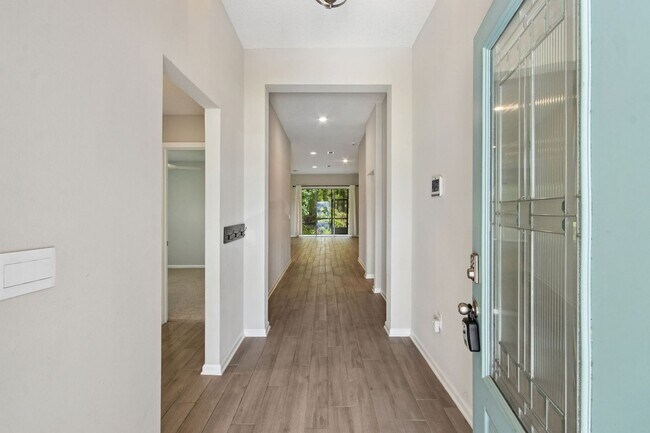 Foto del edificio - Modern 4BR Home with 3 Full Baths in River Glen | Screened Porch & Resort-Style Amenities