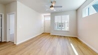 Located at 102 Francis Rd in Hendersonville, NC, this single-floor, one-bedroom, one-bathroom home offers a well-designed layout with modern finishes throughout. The open-concept kitchen and living area serves as the heart of the home, featuring warm hardwood-style flooring, recessed lighting, and a ceiling fan. The kitchen is outfitted with crisp white shaker cabinets, dark granite countertops, a subway tile backsplash, stainless steel appliances, and a central island with open shelving — providing both prep space and additional storage. Natural light flows in through multiple windows dressed with clean white blinds. The living area is bright and airy, with a ceiling fan and a welcoming entry door. The bedroom is a comfortable retreat finished with plush carpet, a ceiling fan, and windows that allow ample natural light. The bathroom features hardwood-style flooring, a glass-enclosed shower, a white vanity with dark granite countertops, and direct access to a dedicated walk-in closet equipped with wire shelving systems for organized storage. The clean, neutral color palette and consistent finishes throughout give the home a cohesive, move-in-ready feel.