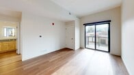 This contemporary apartment in Grand Rapids offers 700 square feet of efficiently designed living space. The unit features two bedrooms and two full bathrooms, making it ideal for small families or roommates. The heart of the home is a modern kitchen, equipped with light wood cabinetry, stainless steel appliances, and a practical layout. Hardwood floors run throughout, lending warmth and continuity to the space.

Large windows in the living areas and bedrooms flood the apartment with natural light and provide city views, creating an open, airy ambiance. The bathrooms are tastefully appointed, with one featuring a shower/tub combination and the other a vanity with ample storage. A private balcony extends the living space outdoors, offering a spot for fresh air and urban vistas.

The apartment's neutral color palette and clean lines contribute to its modern aesthetic. Built-in closets and storage solutions help maximize the compact floor plan. Located in a multi-story building, this unit combines the convenience of urban living with a comfortable, contemporary design.