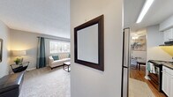 Located at 1315 Morreene Rd in Durham, NC, this single-floor, 3-bedroom, 2-bathroom home offers a well-organized layout with a practical and comfortable design throughout. The open living room features plush carpeting, a textured ceiling, and a large window that invites natural light, creating a warm and welcoming atmosphere. Adjacent to the living area, the galley-style kitchen is equipped with white cabinetry, dark countertops, hardwood flooring, and black appliances, including a range and refrigerator, providing ample prep and storage space. The primary bedroom is generously sized, offering a walk-in closet, carpet flooring, and a window for natural light. The two additional bedrooms are comfortably scaled, each with carpet flooring, windows with blinds, and closet storage — ideal for guests, family members, or a home office. The two bathrooms are clean and functional, with one featuring a full soaking bathtub. Neutral gray walls and consistent finishes throughout the home create a cohesive, modern aesthetic. The efficient single-floor plan ensures easy flow between all rooms, making this Durham residence a practical and inviting place to call home.