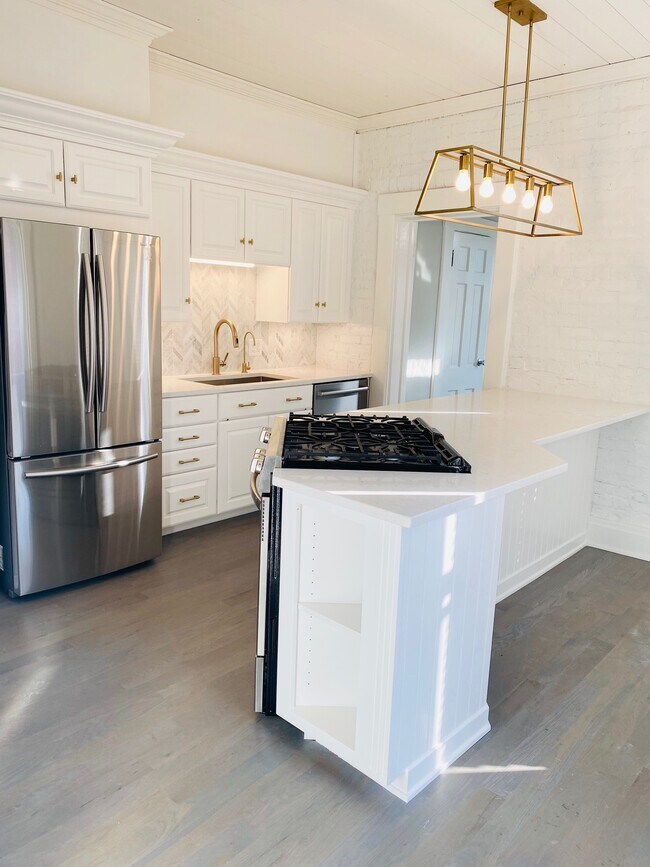 New oak floors in kitchen, entire house hardwoods refinished - 115 E Willow St