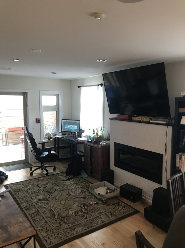 Natural gas fire place underneath 65 inch tv, plus work station - 1013 S 12th St