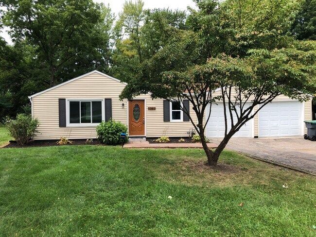 Front of the house with driveway and 2 car garage entry - 1050 Janet Dr