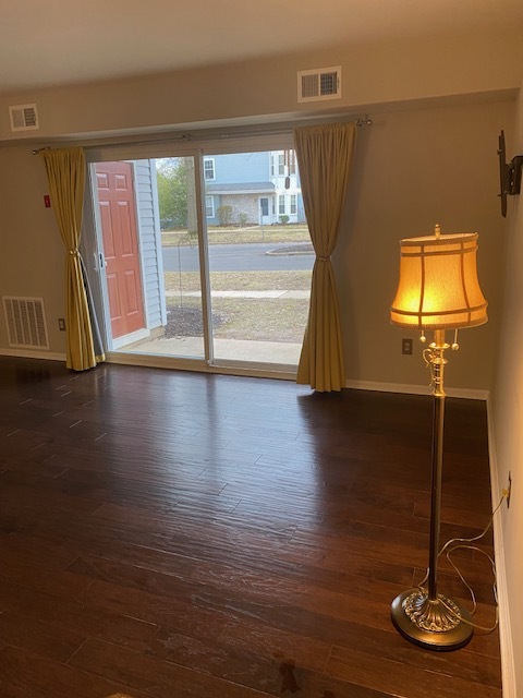 Living room looking out through sliding doors to patio - 105 Hopkins Ct