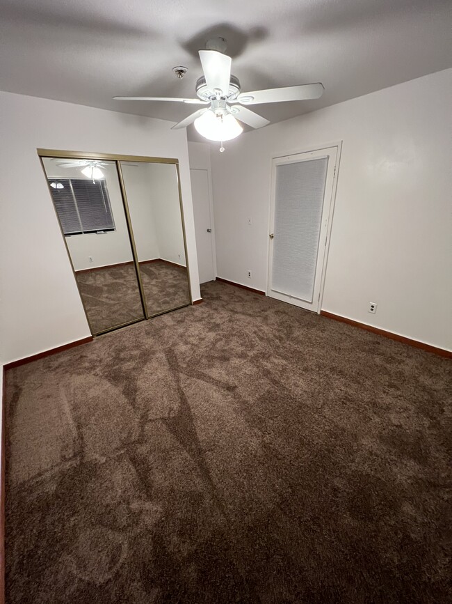 Bedroom w/new carpet & separate entry - 7822 Genesta Ave