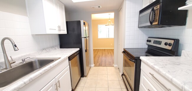 There's cabinets galore in this kitchen and a pantry. You'll have ample storage for all your kitchen - 920 Pine Oak Trl
