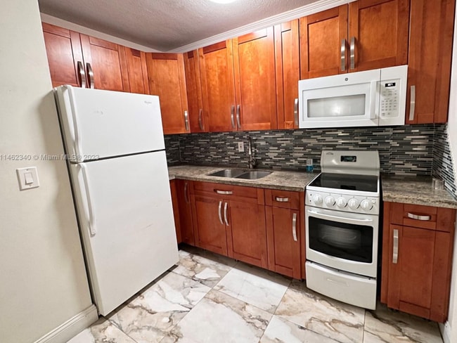 Building Photo - 4265 NW S Tamiami Canal Dr