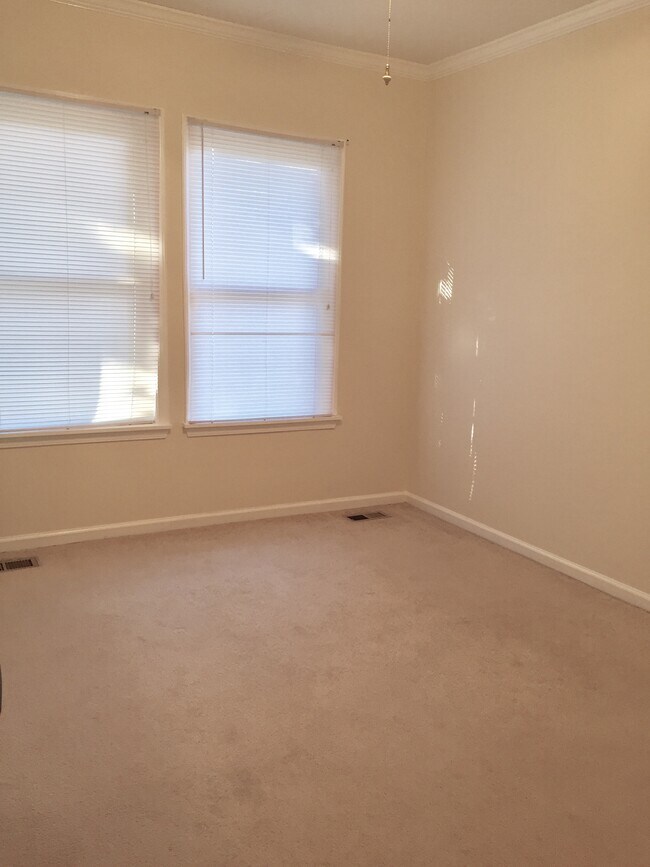 Back bedroom with larger closet and will also have carpeting removed and replaced with laminate flooring. - 1202 E. Catawba St.