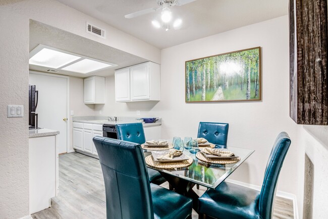 Charming Dining Area with Kitchen View - Windrush Apartments