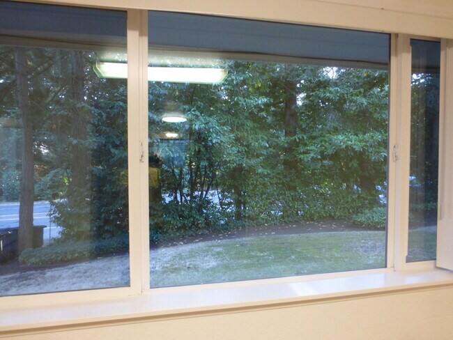 Large living room window has two sections for air flow. - 20842 1st Ave S