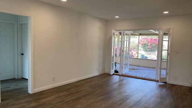 open floor connects French door to enclosed back yard patio - 1229 Norgate St
