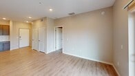 This well-designed 850 square foot apartment in Cypress offers a practical and contemporary living space. The single-floor layout comprises two bedrooms, including a spacious 160 square foot primary bedroom, and two full bathrooms. The heart of the home is an open-concept kitchen and living area, featuring modern stainless steel appliances, ample cabinet space, and a sleek design with a neutral color palette.

The kitchen boasts wooden cabinetry, a subway tile backsplash, and a convenient breakfast bar. Throughout the apartment, you'll find a combination of durable laminate flooring in the main living areas and plush carpeting in the bedrooms, creating a cozy atmosphere. Large windows, including a sliding glass door, flood the space with natural light and provide scenic outdoor views.

Both bathrooms are equipped with modern fixtures, including one with a shower/tub combination. The apartment also features two closets for additional storage. Recessed lighting and ceiling fans add to the overall comfort and ambiance of this efficiently designed living space.