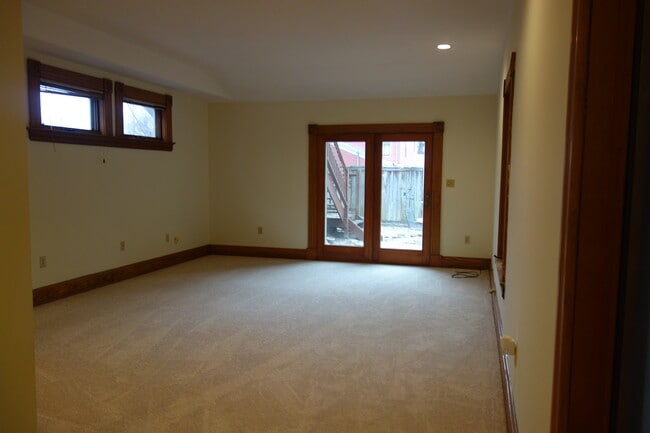HUGE living room with walk out to courtyard. Lots of windows for natural light. - 216 Kentucky