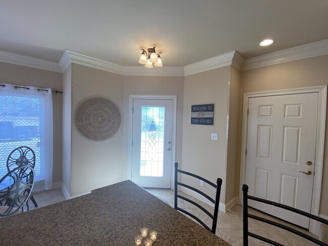 front door and door from garage - 20283 La Savane Dr