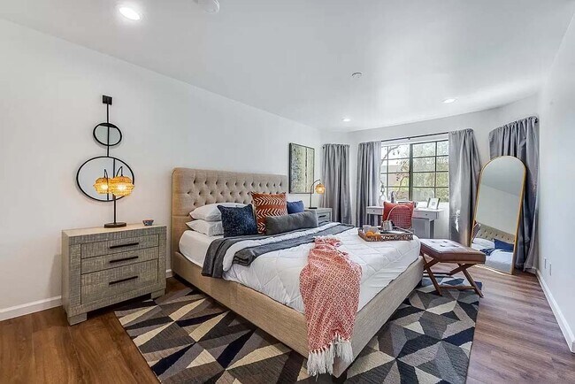Large master bedroom with large closet and bay windows - 10220 De Soto Ave