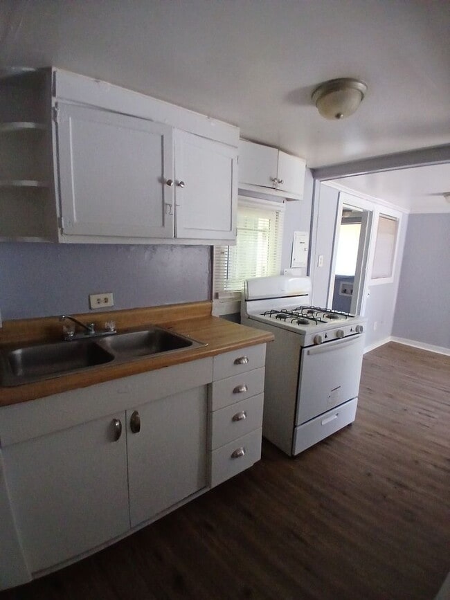 Building Photo - Ideally located 2-bedroom, 1.5-bathroom home nestled in a highly sought-after neighborhood - $99 ...