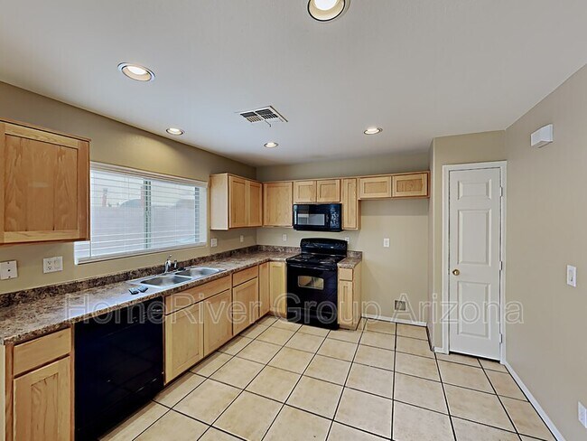 Building Photo - 6413 W Valencia Dr