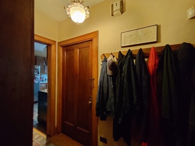 The entrance hall of the unit has a linen closet and room for coats. - 1407 Monroe St