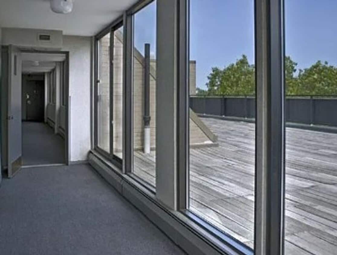 Building Photo - GREAT Studio! Right on Green Line. Laundry in building, roof deck, great view!