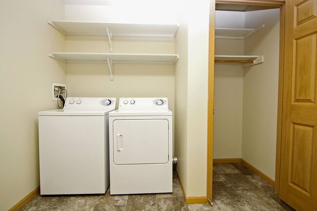 The Gulf floor plan offers a spacious laundry room with storage. - Pinebrook Apartments